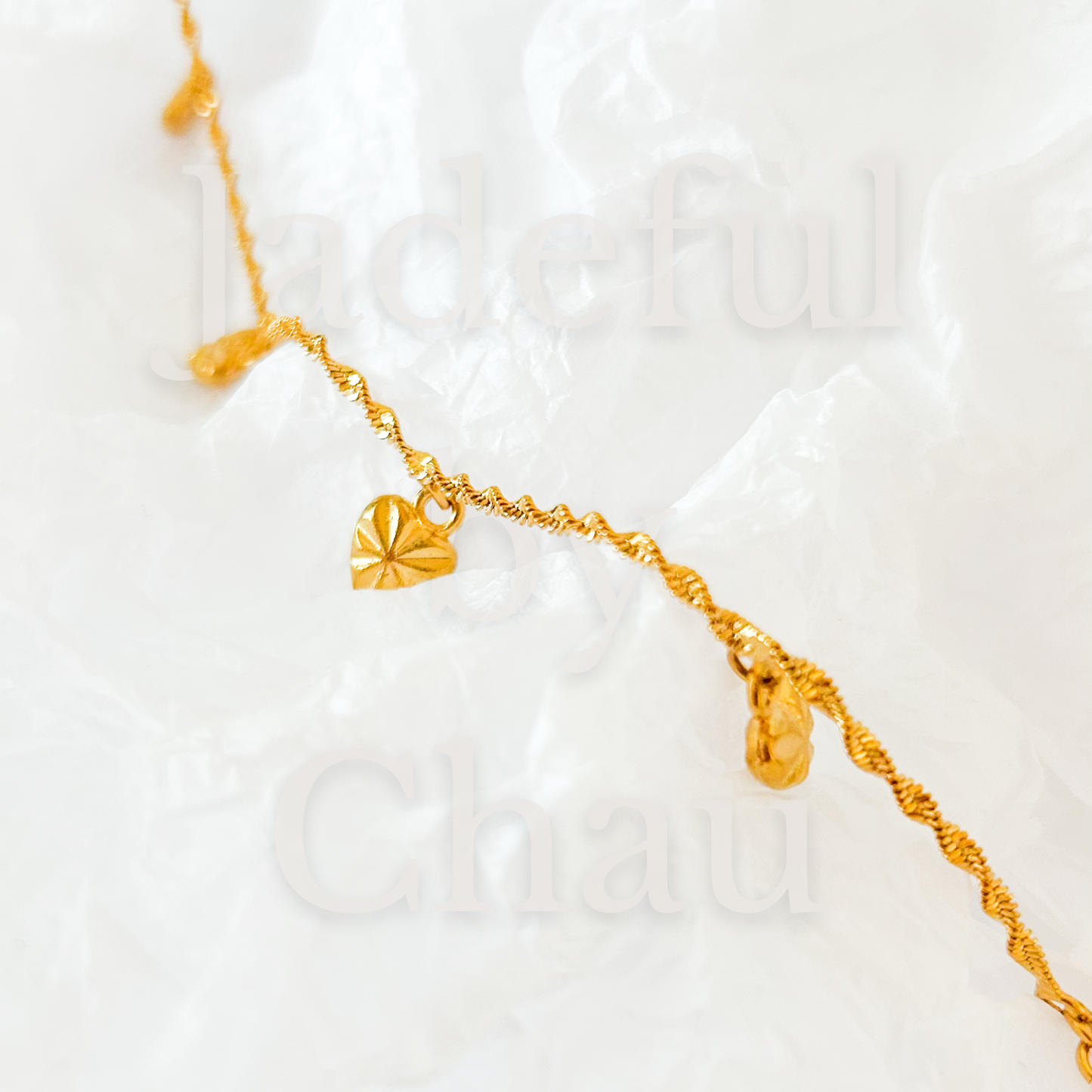 TWISTED LOVE Armkette – Gold