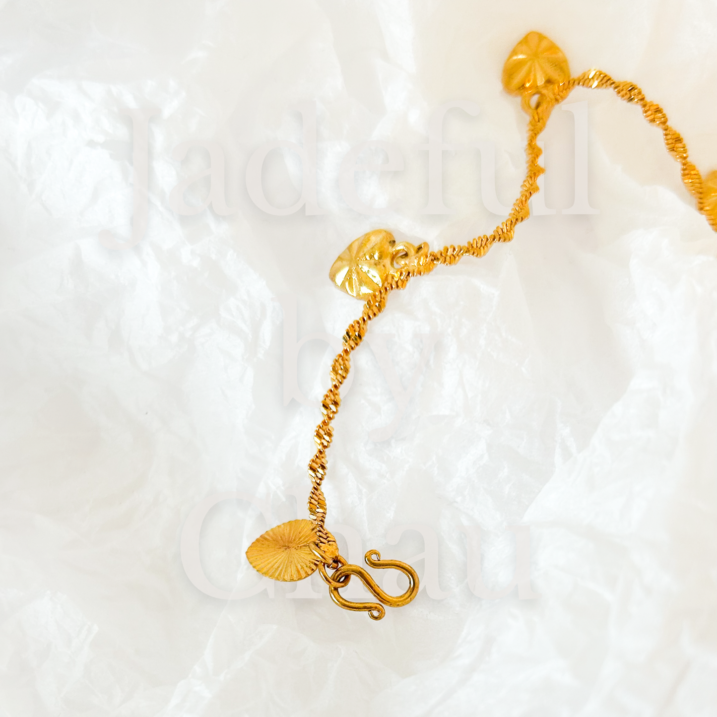 TWISTED LOVE Armkette – Gold
